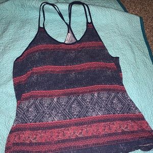Maurice’s red and blue tank top